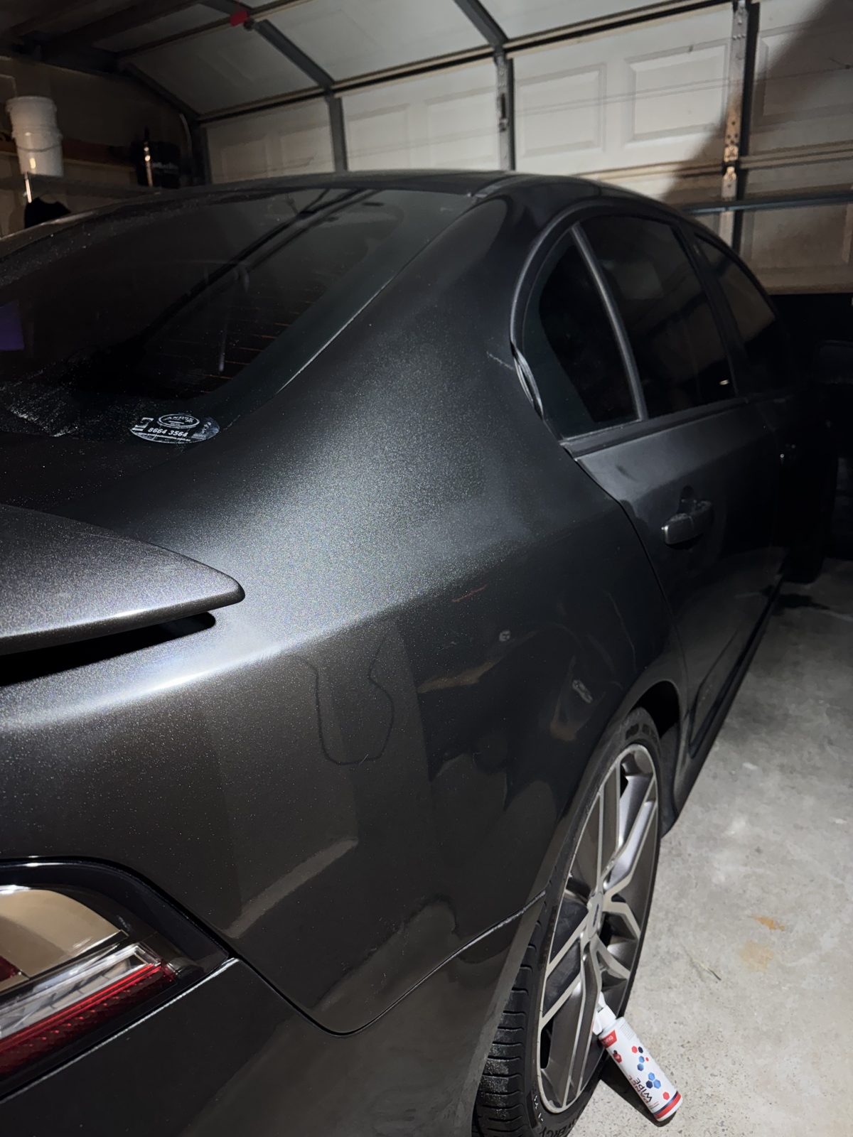 Same Ford Falcon rear quarter after correction, deep metallic gloss restored