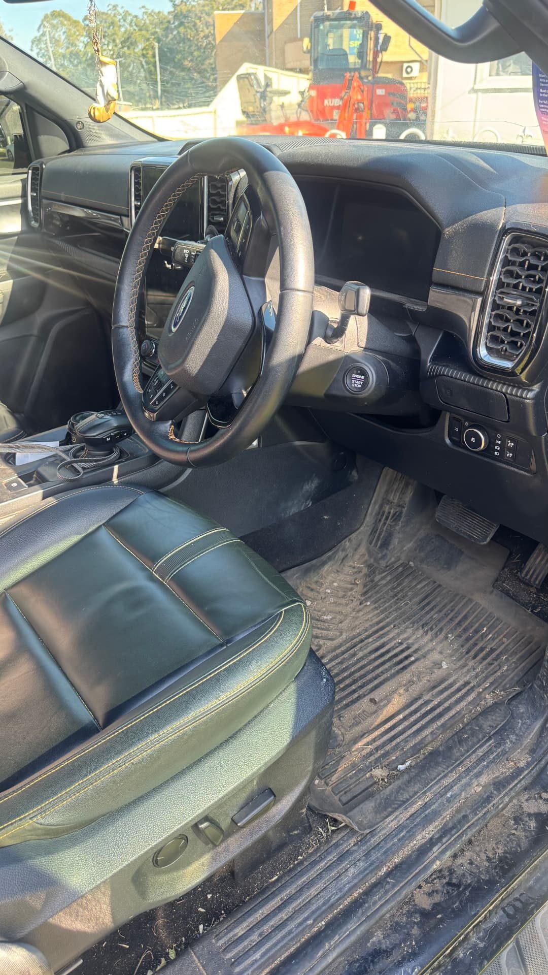 Ford Ranger interior before detailing, dirt on mats and trim